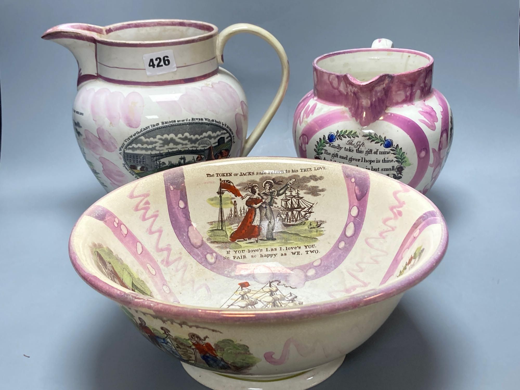 Two early 19th century Sunderland pink lustre jugs and similar bowl, transfer printed and enamelled, tallest jug 21cm